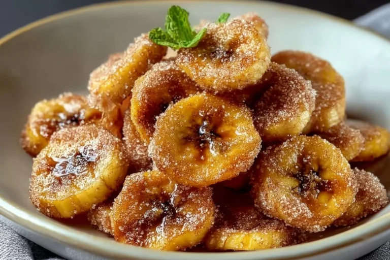 Delicious cinnamon-sugar air fryer banana chips served in a bowl.